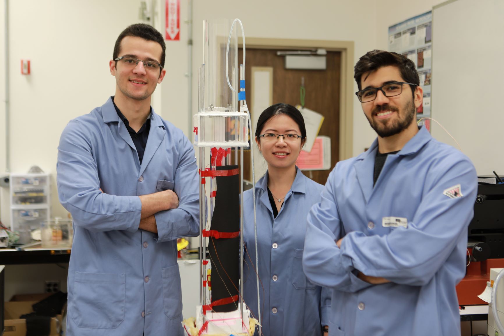 UCLA researchers (from left) Abolfazl Sadeghpour, Hangjie Ji and Navid Dehdari Ebrahimi with their experimental water capture apparatus / Photo credits: UCLA Newsroom